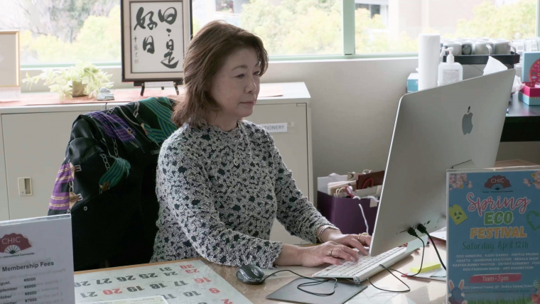 ボランティアとしてコミュニティの活動に参加している中村さんの写真